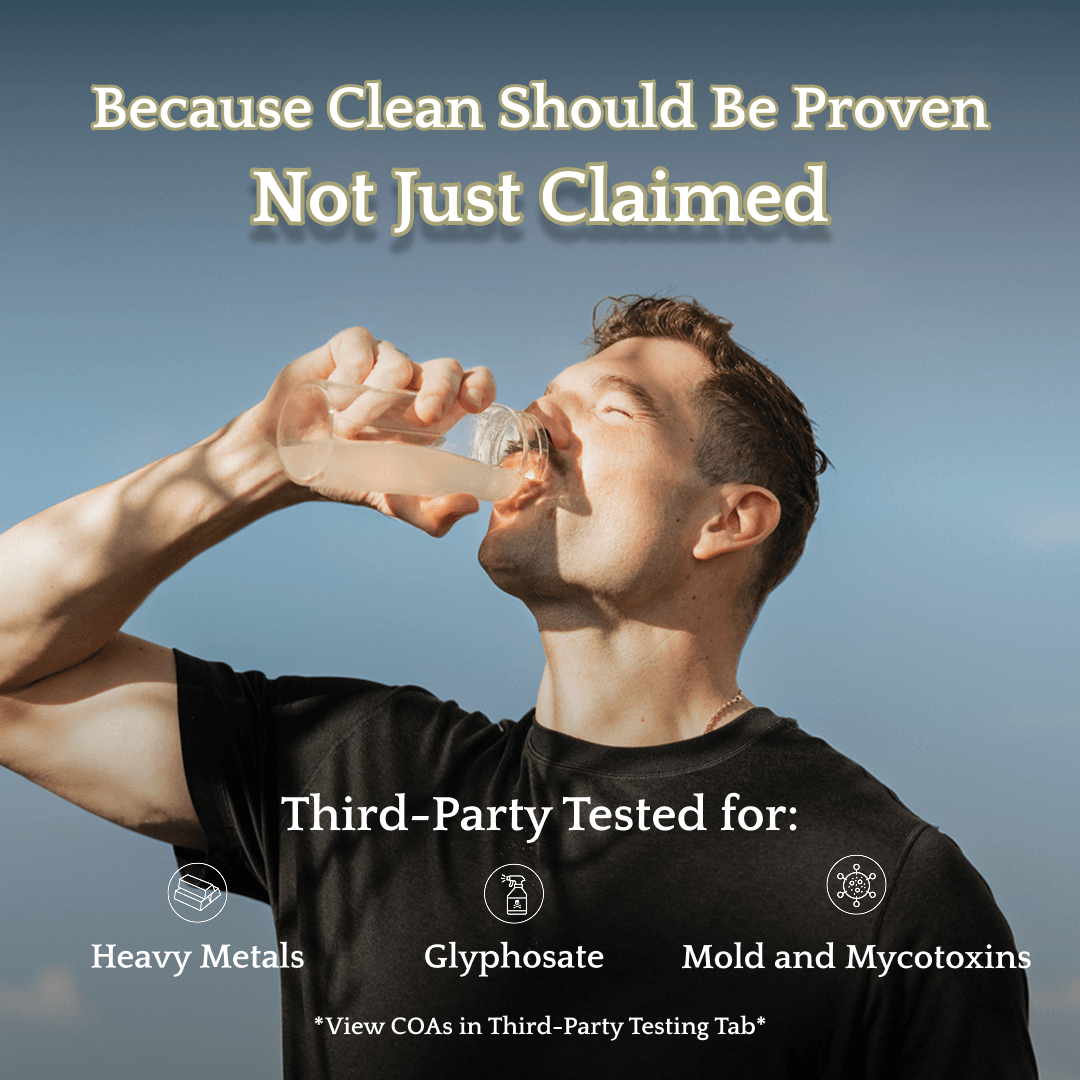 Person drinking a glass of water with electrolytes to rehydrate